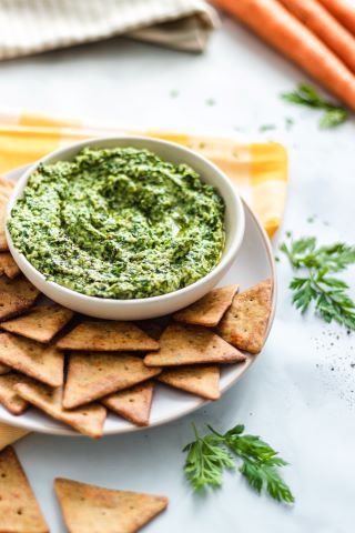 Upcycled Carrot Tops Pesto served with Mediterranean Herb Veggie Pita Crackers Recipe