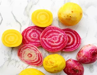 Sliced and whole yellow and red beets are a nutrient dense vegetable 