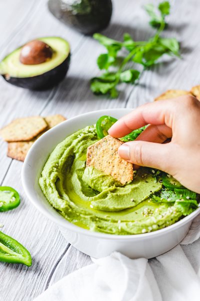 Avocado-Hummus-10.jpg Spicy Avocado Hummus served with Sprouted Seed Crackers Jalapeno