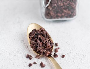 cacao-nibscrop.jpg Cacao nibs on a spoon. Have prebiotic qualities