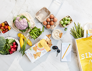 Meal-Prep2_Mindful-Shopping.png Healthy ingrdients, shopping list, Simple Mills reusable bag and Veggie Pita Crackers on a counter