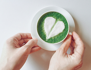 matcha.jpg Cup of matcha green tea, decorated with a white foam heart
