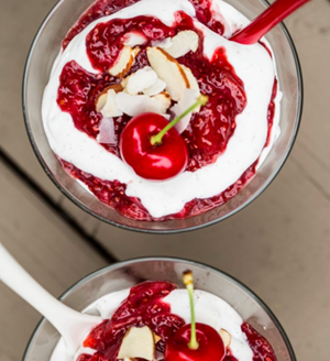 Cherry-strawberry chia seed fool with vanilla bean coconut whipped cream 