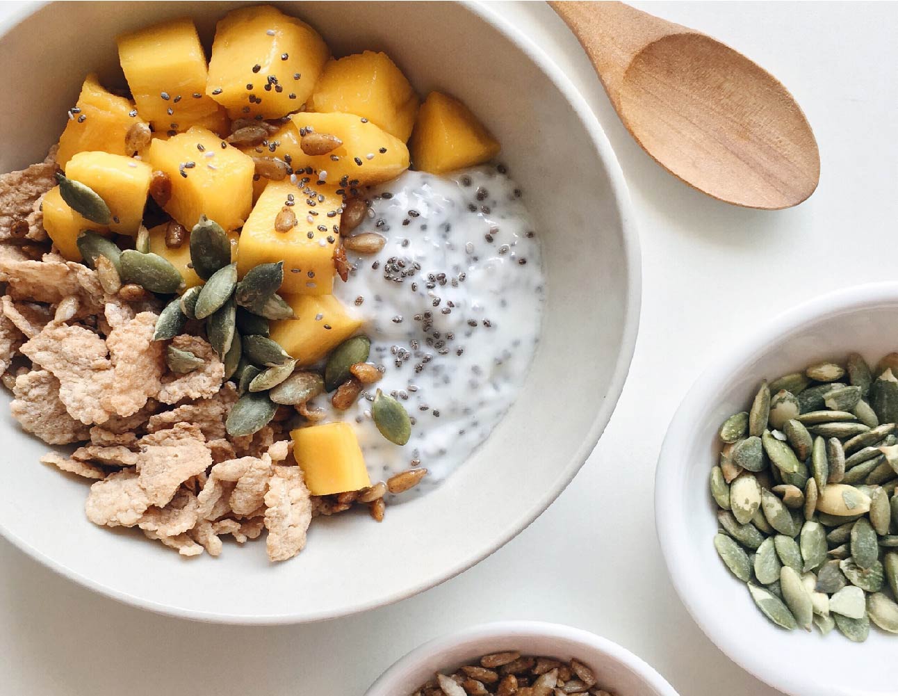 Bowl filled with nutrient dense foods including pumpkin seeds 