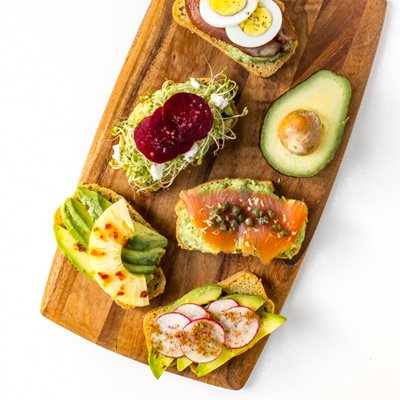 Avocado-Toast,-top-down,-close-up,-all-variations,-angled,-wooden-board.jpg Grain Free Avocado Toast 5 Ways made with Almond Flour Baking Mix Artisan Bread